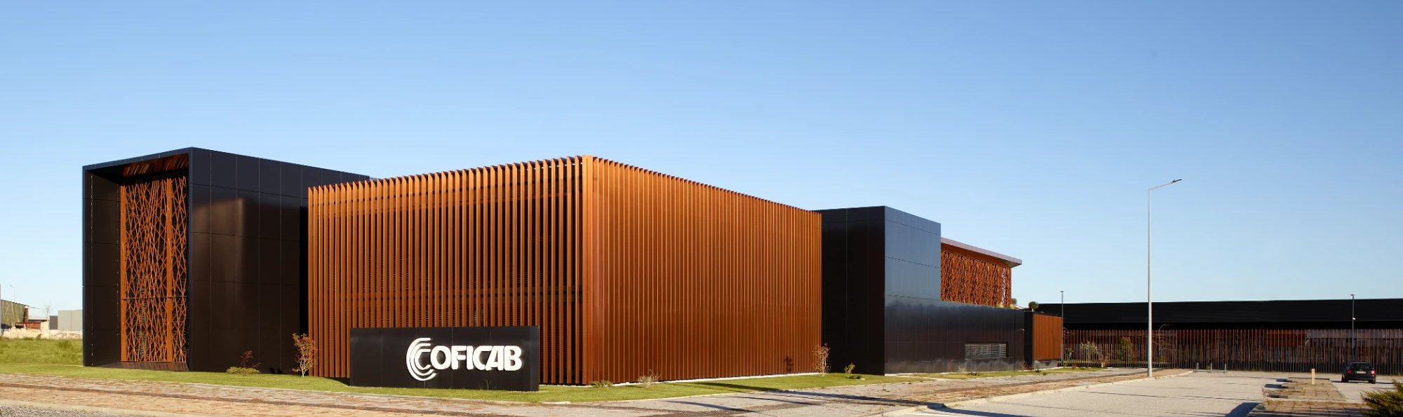 COFICAB manufacturing site with copper-colored facade
