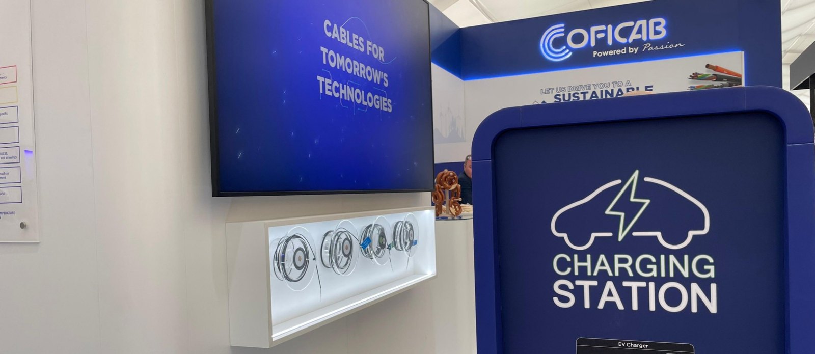 COFICAB stand with an EV charging station